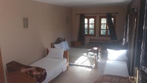 Katil atau katil-katil dalam bilik di Ecolodge Espace Tamount