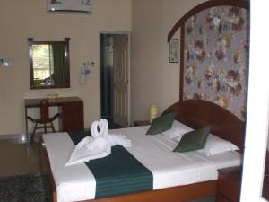 Кровать или кровати в номере A's Holiday Beach Resort +18 фотографий