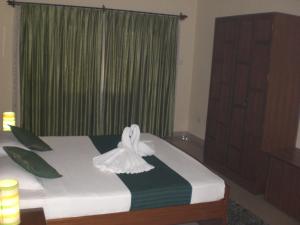 Кровать или кровати в номере A's Holiday Beach Resort