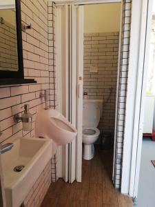 a bathroom with a sink and a toilet at Hvar centre dorms in Hvar