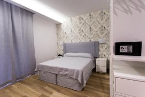 Postel nebo postele na pokoji v ubytování B&B Maria Rosaria