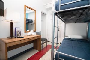 a bedroom with a bunk bed and a desk at West Side YMCA in New York