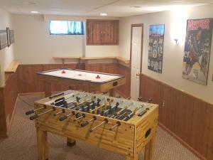 a game room with a table and ping pong ball at Sarnia's Man Cave welcomes you... Game ON! in Sarnia