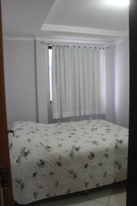 En eller flere senger på et rom på Apartamentos Morada do Sol