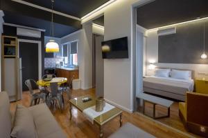 A television and/or entertainment centre at ATHENIAN YARD SUITES