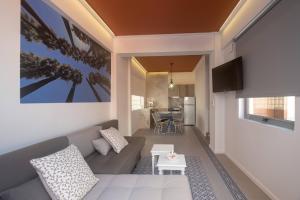 A kitchen or kitchenette at ATHENIAN YARD SUITES