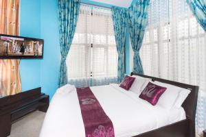 Letto o letti in una camera di LikeMyHome Homestay Mysore