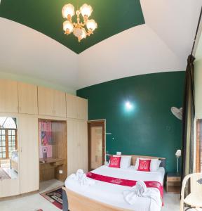 Letto o letti in una camera di LikeMyHome Homestay Mysore