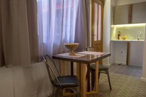 A kitchen or kitchenette at ATHENIAN YARD SUITES