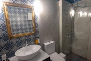 A bathroom at ATHENIAN YARD SUITES