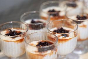 a group of glasses filled with desserts on a table at ATHENIAN YARD SUITES in Athens