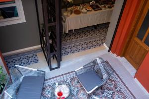 A seating area at ATHENIAN YARD SUITES