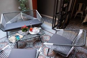 A seating area at ATHENIAN YARD SUITES