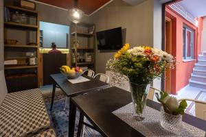 A television and/or entertainment centre at ATHENIAN YARD SUITES