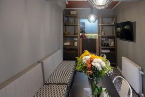 A television and/or entertainment centre at ATHENIAN YARD SUITES