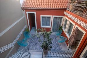 A balcony or terrace at ATHENIAN YARD SUITES
