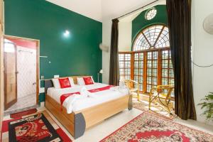 Letto o letti in una camera di LikeMyHome Homestay Mysore