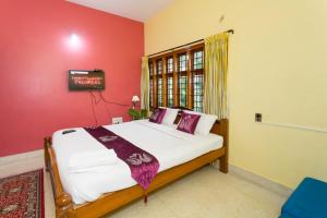 Letto o letti in una camera di LikeMyHome Homestay Mysore