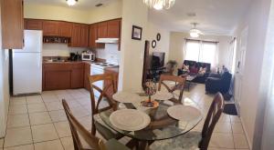a kitchen and dining room with a table and chairs at Great Location near Downtown & Airport in Tampa