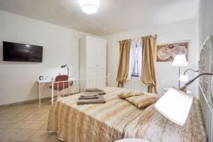 Letto o letti in una camera di Casa Laurentius