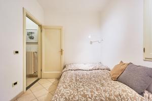 Letto o letti in una camera di Casa Laurentius