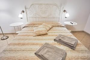 Letto o letti in una camera di Casa Laurentius