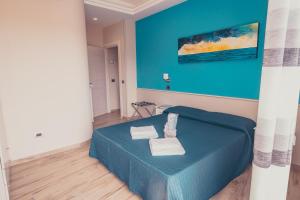 Postel nebo postele na pokoji v ubytování Oltre il Mare Guest House