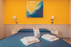 Postel nebo postele na pokoji v ubytování Oltre il Mare Guest House