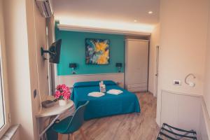 Postel nebo postele na pokoji v ubytování Oltre il Mare Guest House