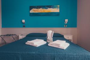 Postel nebo postele na pokoji v ubytování Oltre il Mare Guest House