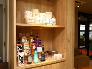a shelf filled with lots of bottles of medicine at Hotel Wing International Korakuen in Tokyo