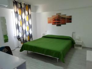 Łóżko lub łóżka w pokoju w obiekcie Casa Mia