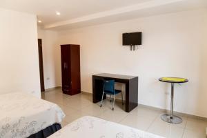 Postel nebo postele na pokoji v ubytování Micro Hotel Rio de Piedras