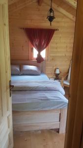 Un pat sau paturi într-o cameră la EtnoPetra