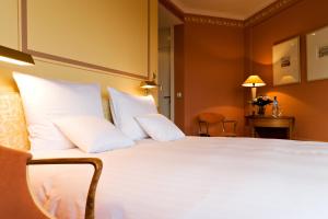 Ένα ή περισσότερα κρεβάτια σε δωμάτιο στο Hotel Parc Belair