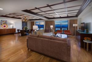 a living room with a couch and a table at Bally's Lake Tahoe Casino Resort in Stateline