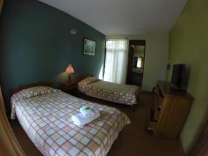 Voodi või voodid majutusasutuse Hotel Guadalupe toas