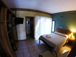 Voodi või voodid majutusasutuse Hotel Guadalupe toas