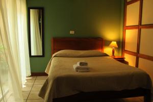 Voodi või voodid majutusasutuse Hotel Guadalupe toas