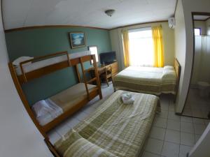Voodi või voodid majutusasutuse Hotel Guadalupe toas