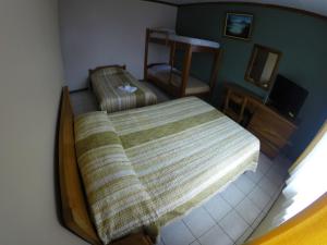 Voodi või voodid majutusasutuse Hotel Guadalupe toas