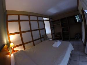 Voodi või voodid majutusasutuse Hotel Guadalupe toas