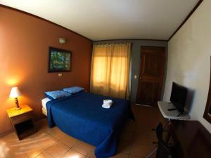 Voodi või voodid majutusasutuse Hotel Guadalupe toas