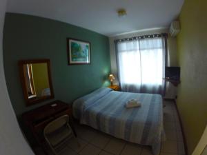 Voodi või voodid majutusasutuse Hotel Guadalupe toas