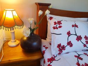 Giường trong phòng chung tại Gowrie Agapanthus