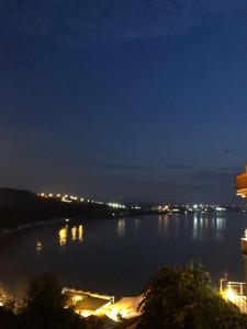 a view of a large body of water at night at Erzurumlu Hotel in Kilyos