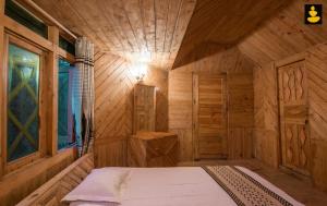 Posteľ alebo postele v izbe v ubytovaní LivingStone Ojuven Treehouses