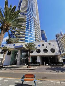 a large building with a large clock on the side of it at OceanView Properties with Widest Balcony in Gold Coast