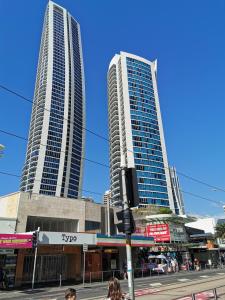 a city street with tall buildings and tall buildings at OceanView Properties with Widest Balcony in Gold Coast