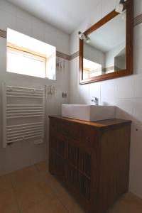 a bathroom with a sink and a mirror at Gite de la Renaissance, Binic , Bretagne in Binic